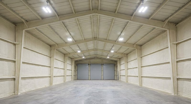 Spray foam insulation in a commercial metal building